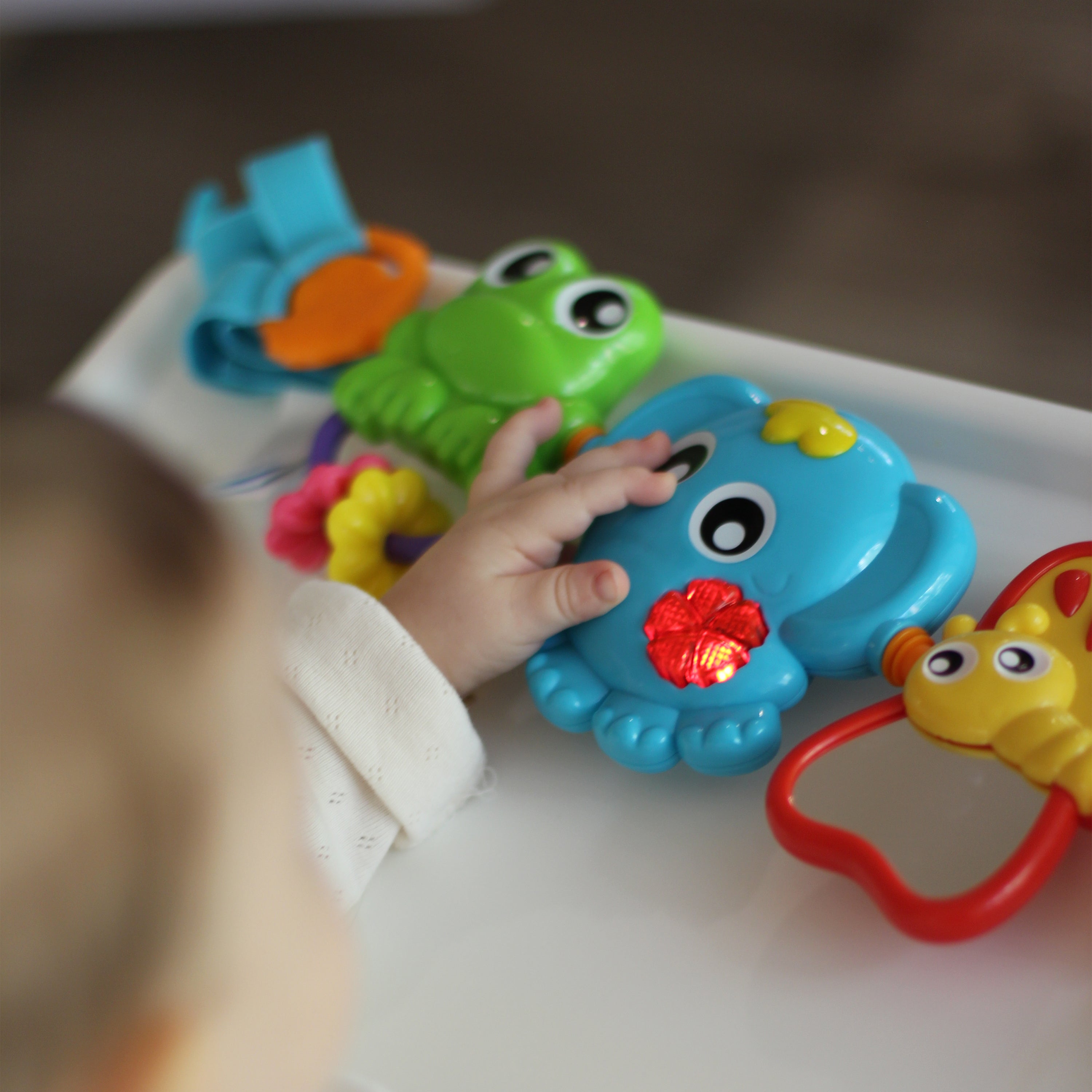 Playgro Travel Trio Musical Pram Tie