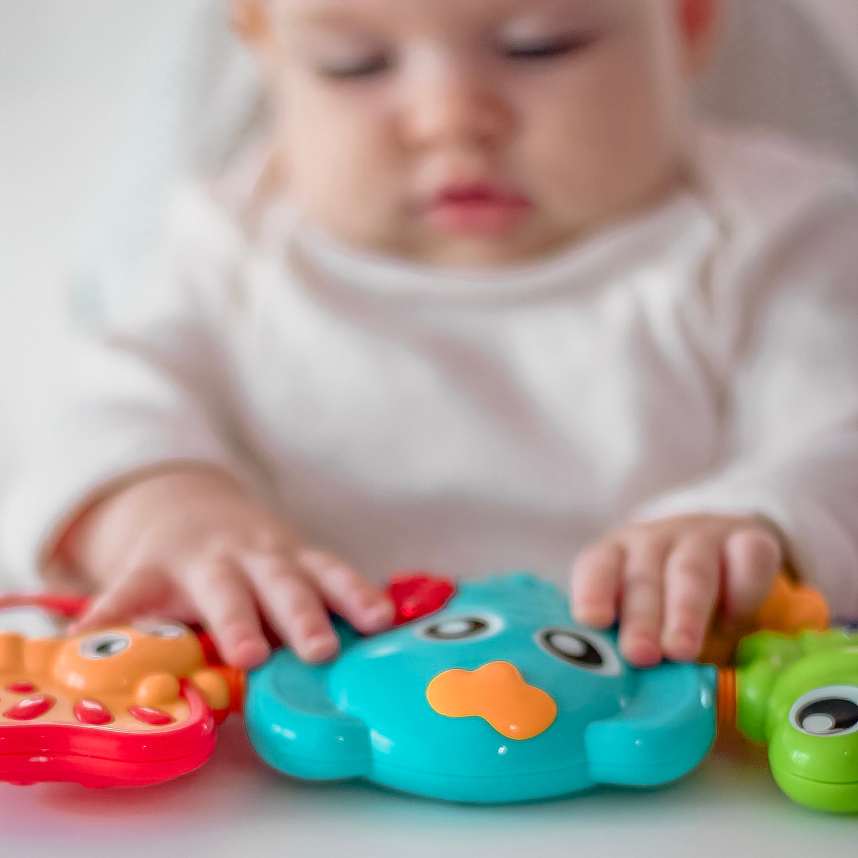 Playgro Travel Trio Musical Pram Tie